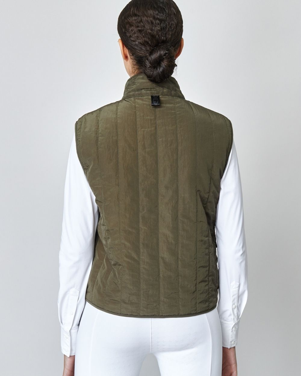 Green Quilted Riding Vest with stand-up collar and front zipper, featuring multiple pockets and embroidered logo.