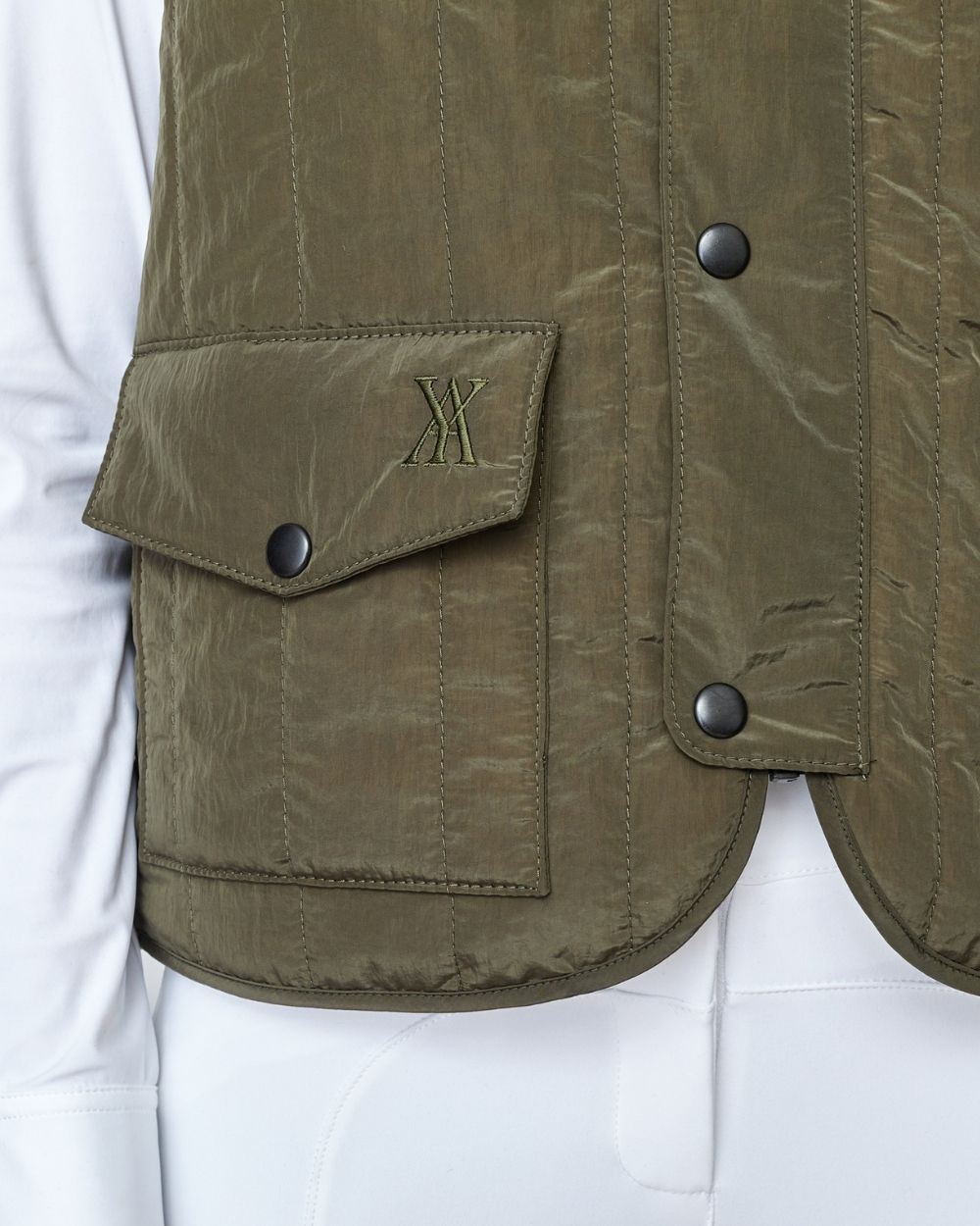 Green Quilted Riding Vest with stand-up collar and front zipper, featuring multiple pockets and embroidered logo.
