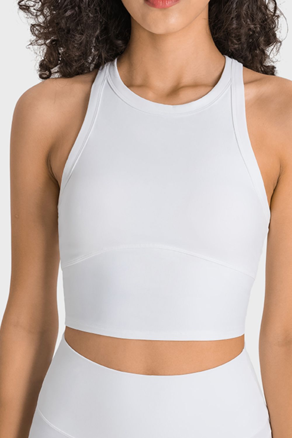 Racerback Cropped Sports Tank in solid color, showcasing its sleeveless design and cropped length, perfect for yoga and workouts.