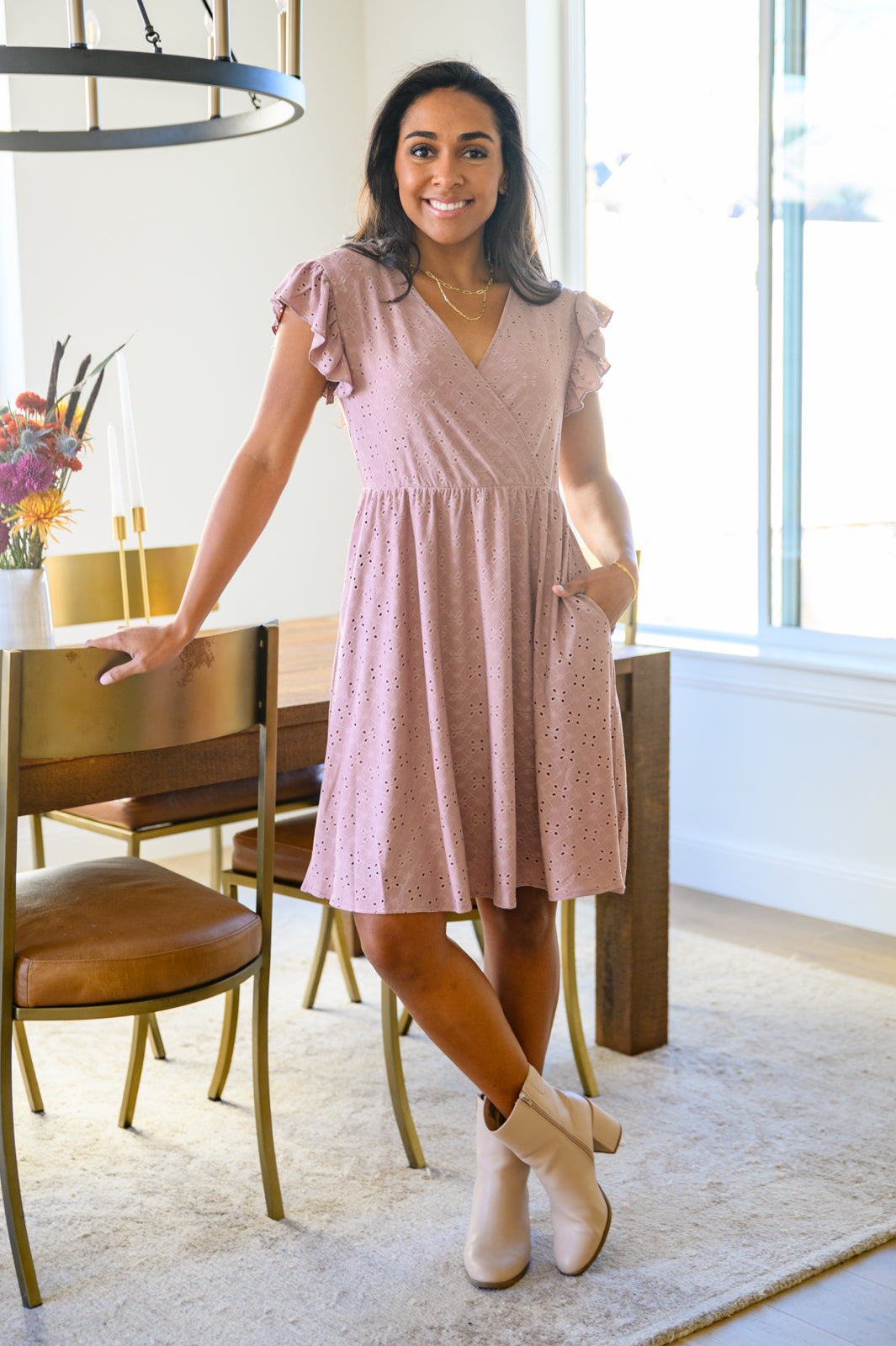 Rebecca Ruffle Eyelet Dress displayed in seven colors, showcasing its soft fabric, elastic waistband, and flattering design.