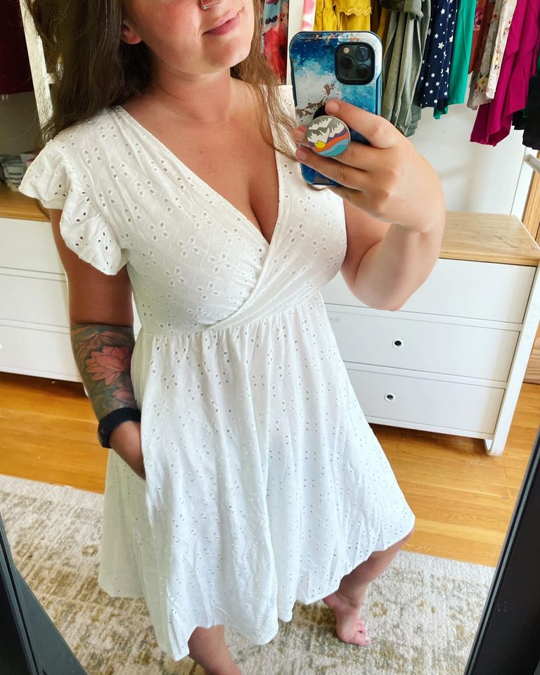 Rebecca Ruffle Eyelet Dress displayed in seven colors, showcasing its soft fabric, elastic waistband, and flattering design.