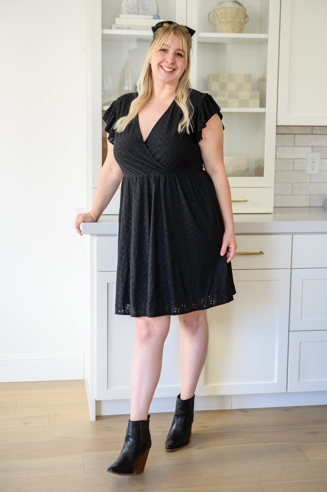 Rebecca Ruffle Eyelet Dress displayed in seven colors, showcasing its soft fabric, elastic waistband, and flattering design.