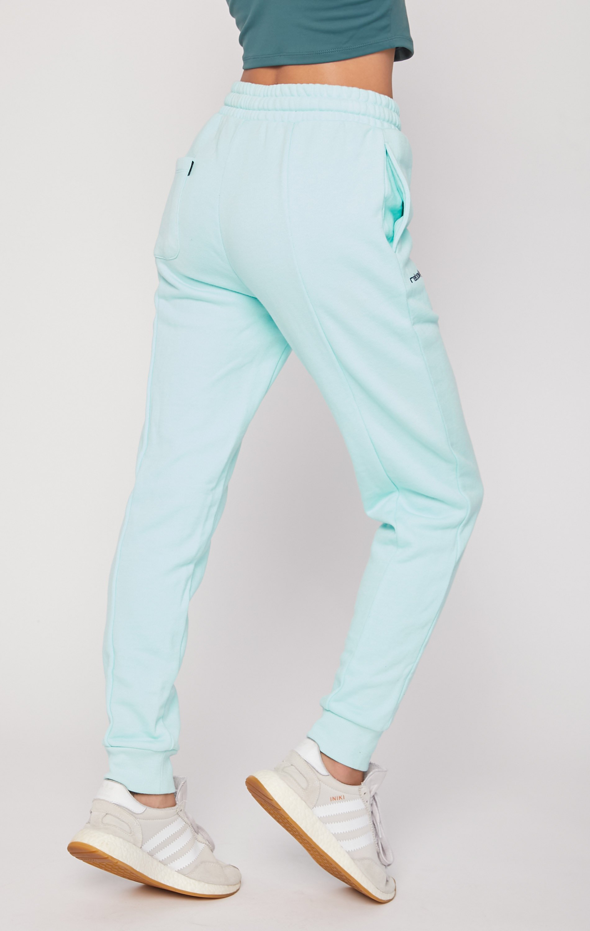 Rebody Pintuck French Terry Sweatpants showcasing stylish vertical seams and adjustable drawstring in a cozy fabric.