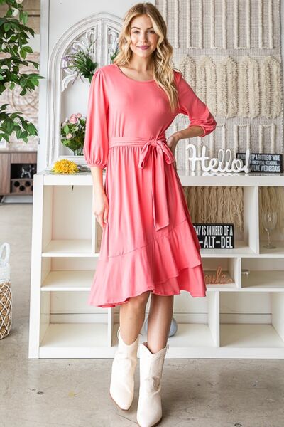 A stylish Reborn J Tie Front Ruffle Hem Dress featuring a playful ruffle hem and adjustable tie front, perfect for summer occasions.