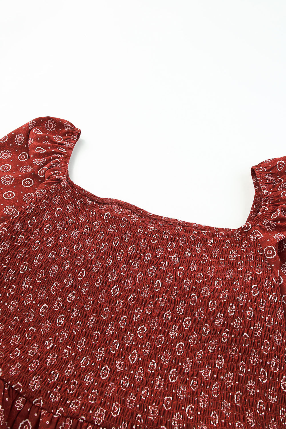 A stylish red plus size square neck printed peplum top, featuring a flattering shirred neckline and elegant pattern print, perfect for various outfits.