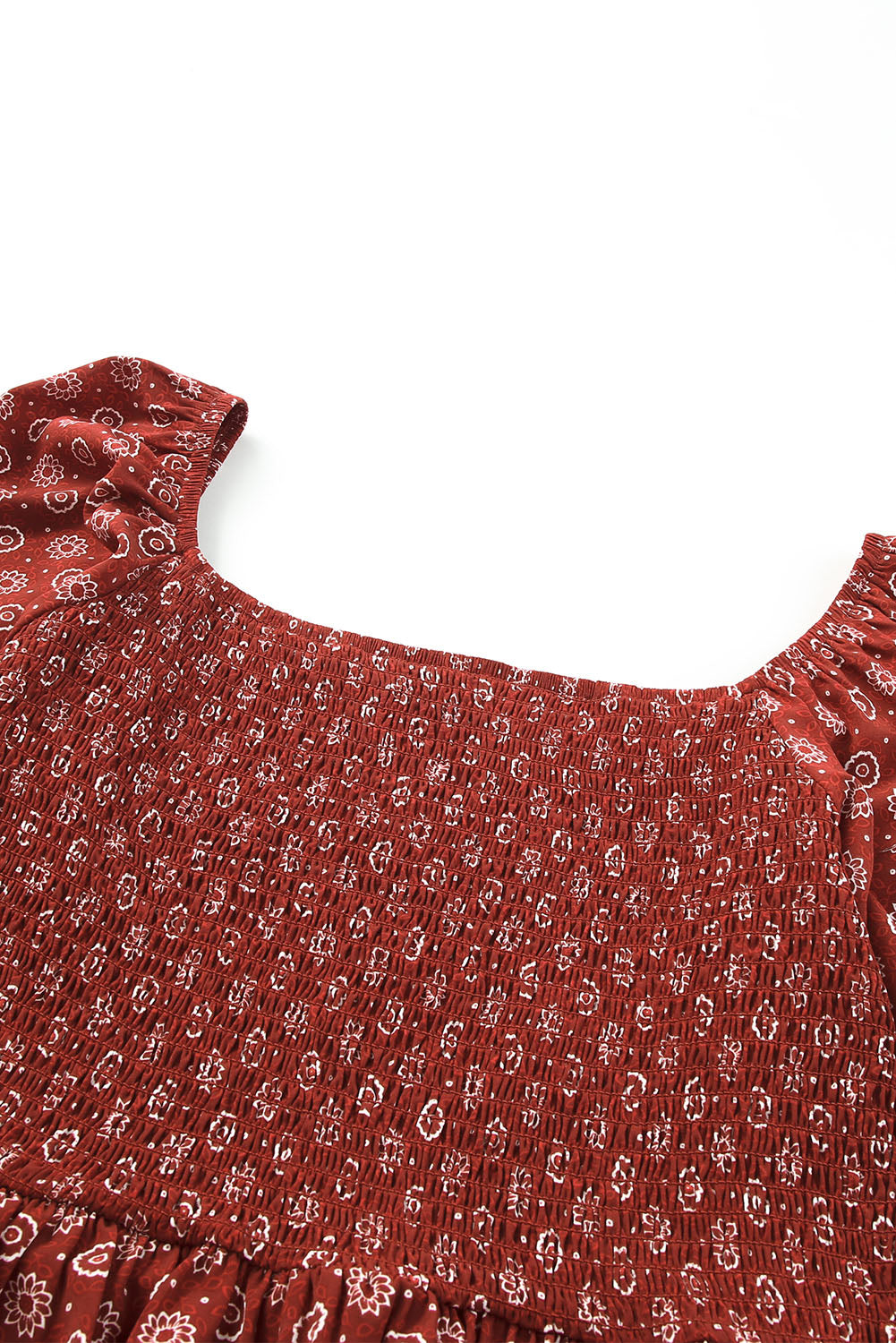 A stylish red plus size square neck printed peplum top, featuring a flattering shirred neckline and elegant pattern print, perfect for various outfits.