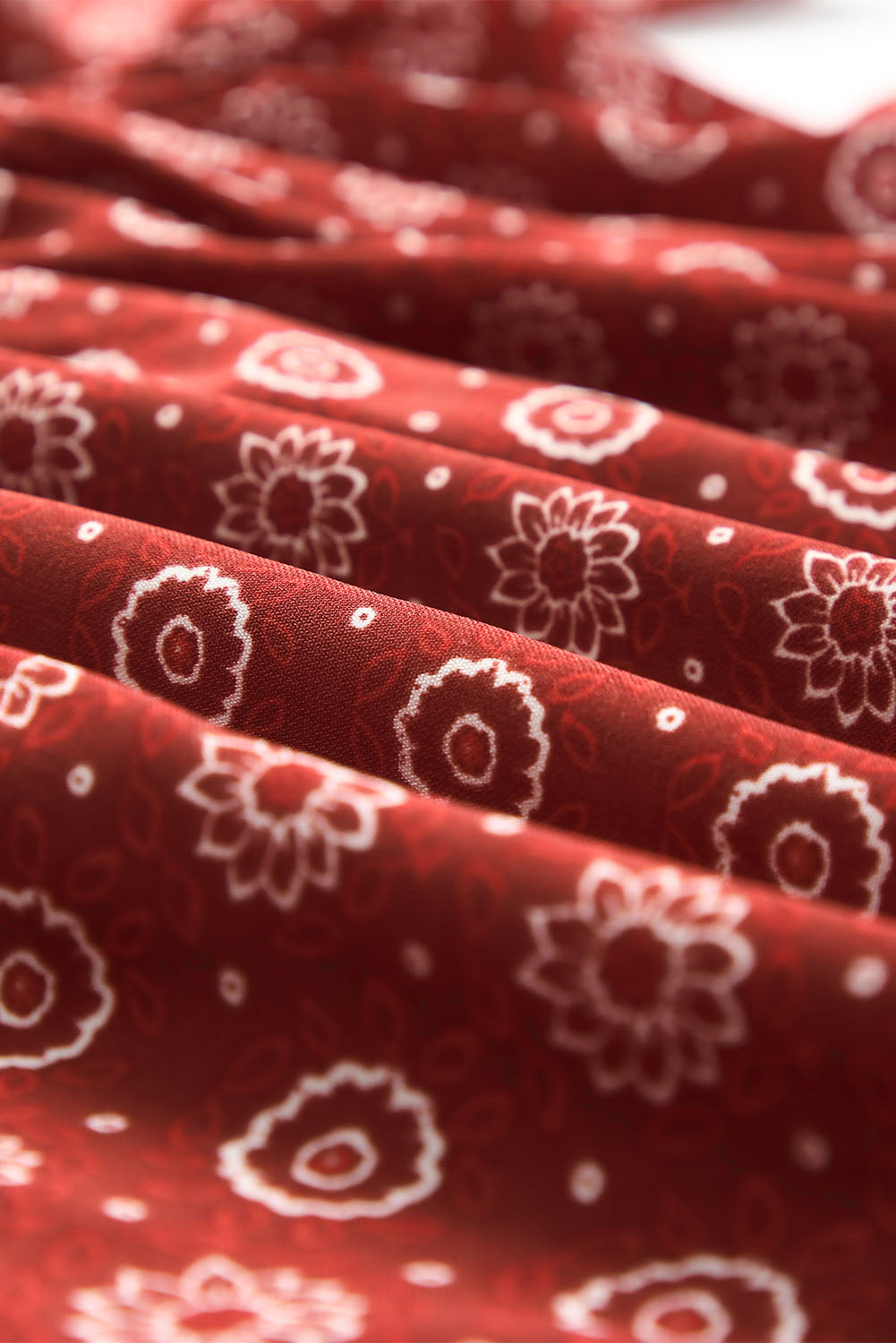 A stylish red plus size square neck printed peplum top, featuring a flattering shirred neckline and elegant pattern print, perfect for various outfits.