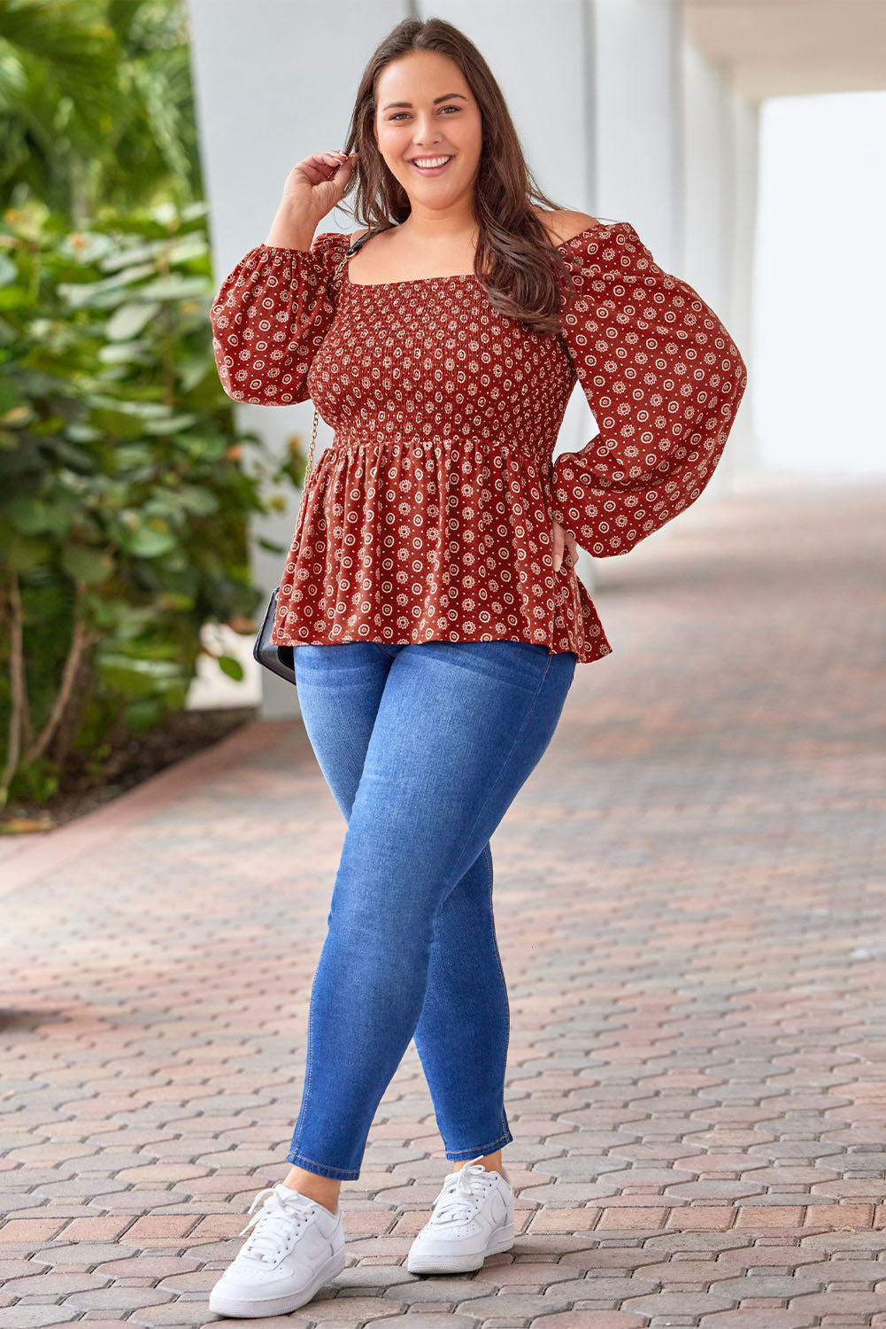 A stylish red plus size square neck printed peplum top, featuring a flattering shirred neckline and elegant pattern print, perfect for various outfits.