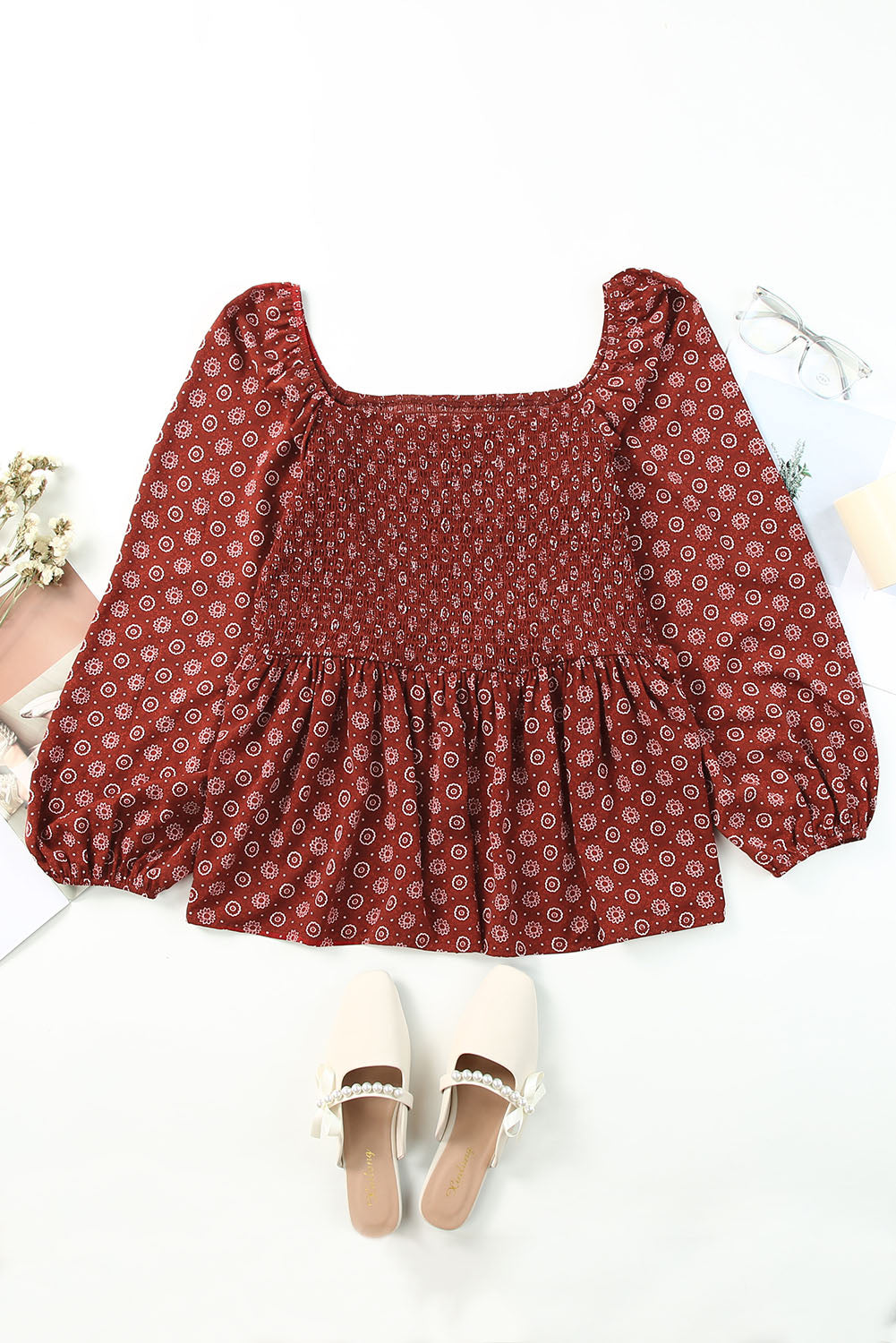A stylish red plus size square neck printed peplum top, featuring a flattering shirred neckline and elegant pattern print, perfect for various outfits.