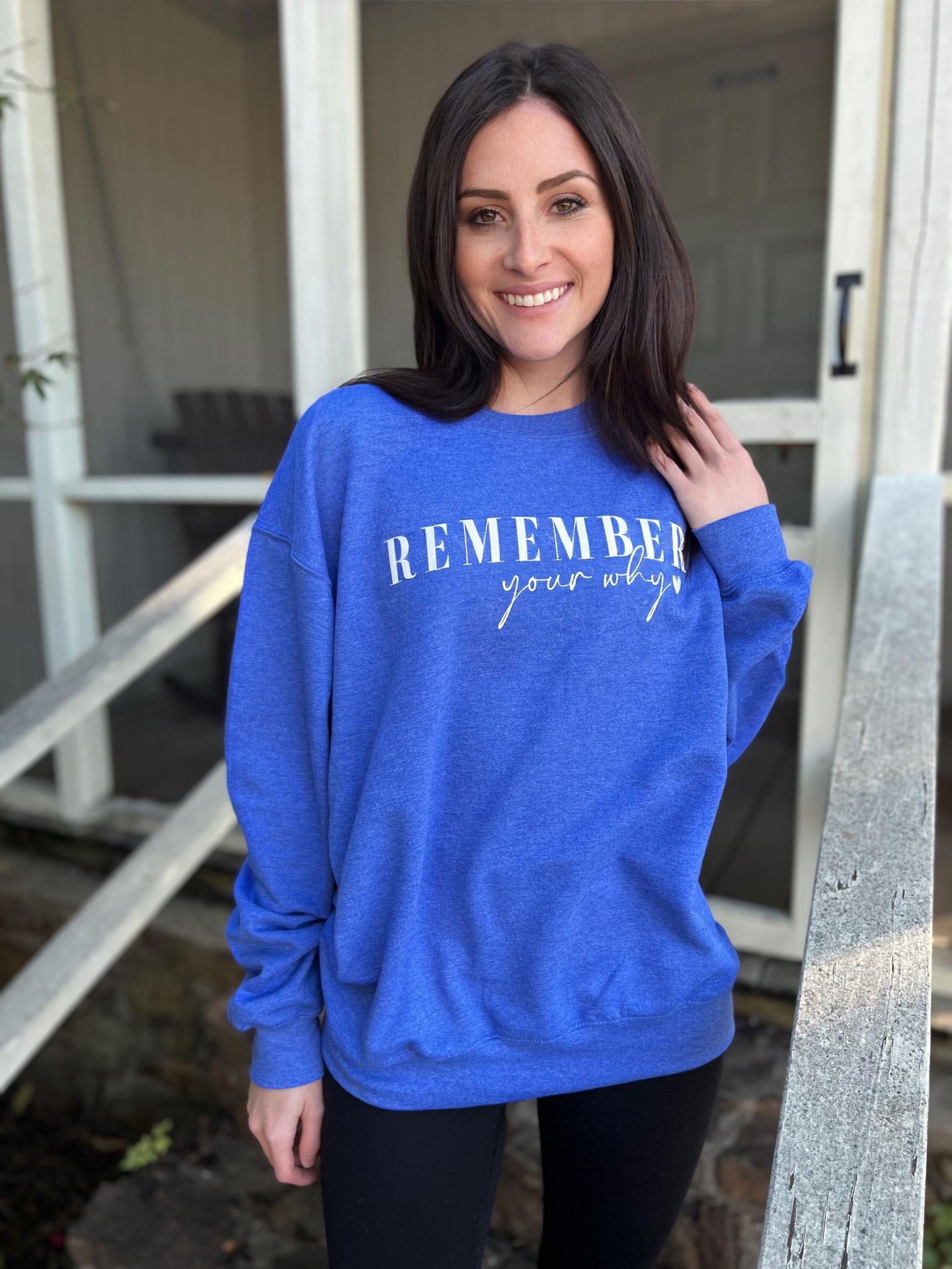 A cozy Royal colored sweatshirt with the phrase 'Remember Your Why' screen printed on the front, showcasing its unisex design.