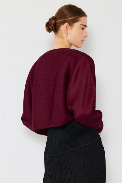Rib pleated puff sleeve bolero cardigan in a stylish design, featuring ribbed texture and feminine puff sleeves, perfect for layering.