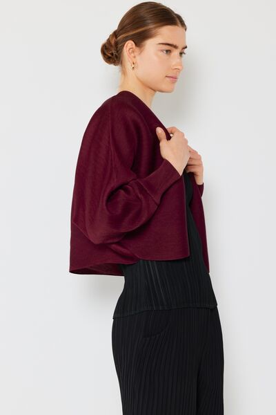 Rib pleated puff sleeve bolero cardigan in a stylish design, featuring ribbed texture and feminine puff sleeves, perfect for layering.