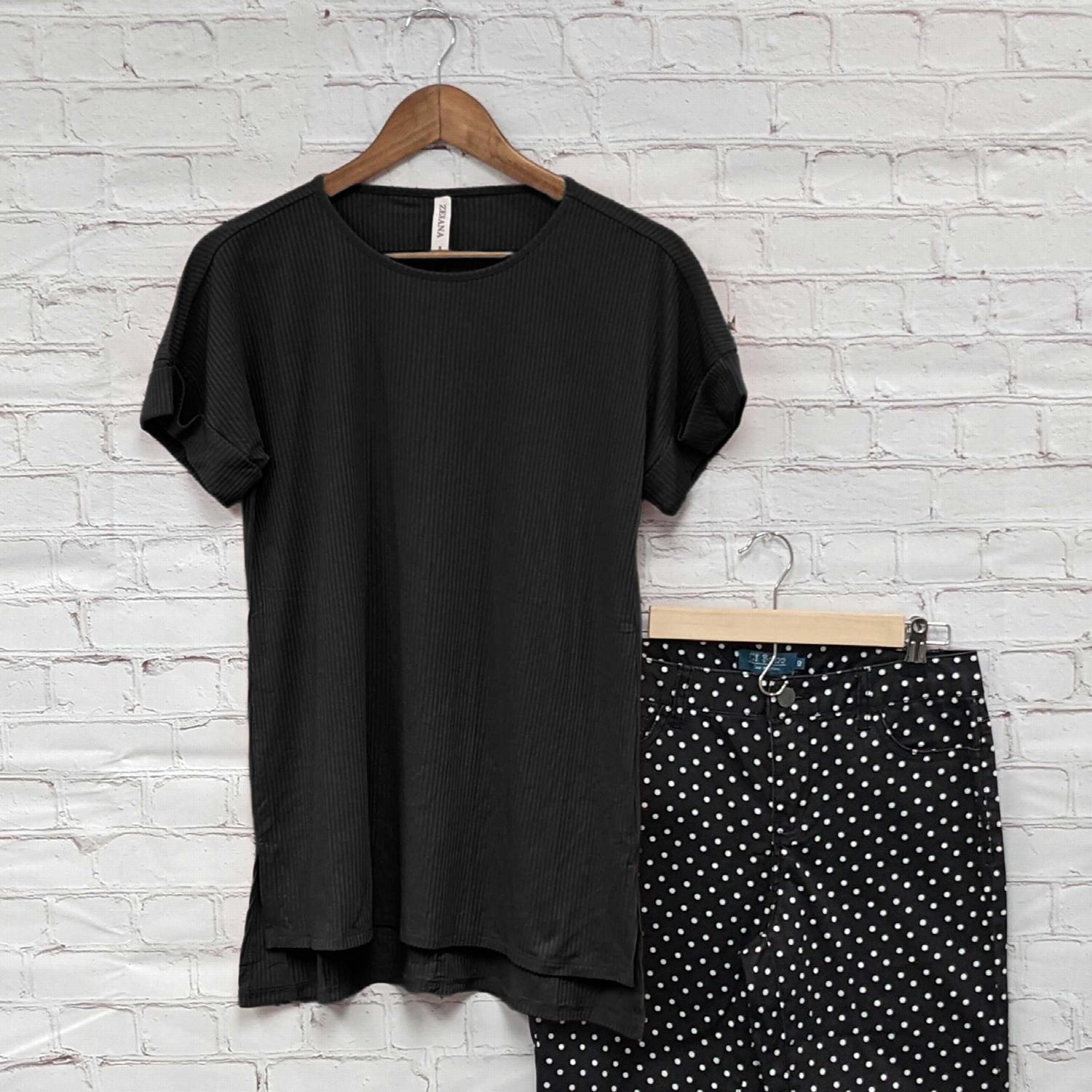 Mustard ribbed round neck hi-low hem top with side slits, showcasing a stylish and comfortable design.