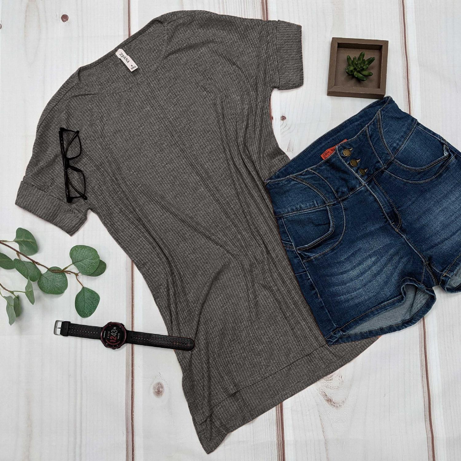 Mustard ribbed round neck hi-low hem top with side slits, showcasing a stylish and comfortable design.