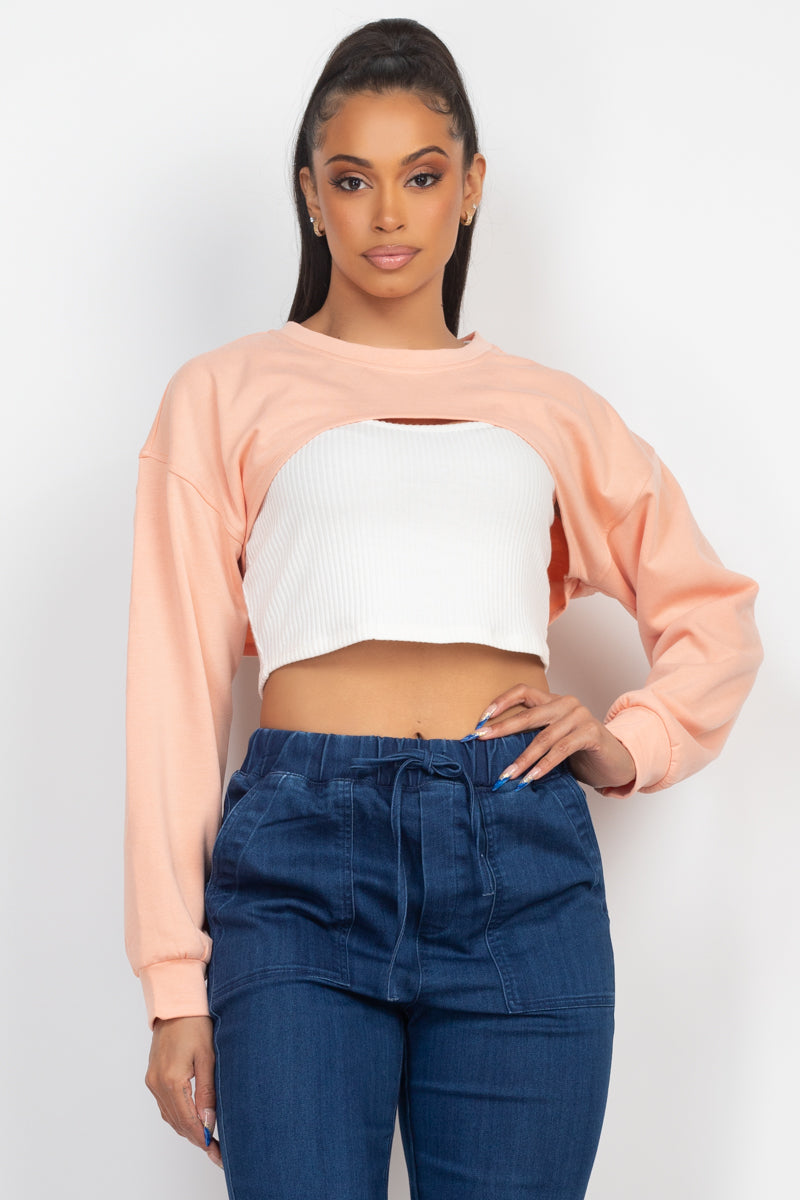 Light peach ribbed sleeveless top with matching shrug sweater, showcasing a scoop neckline and long sleeves.