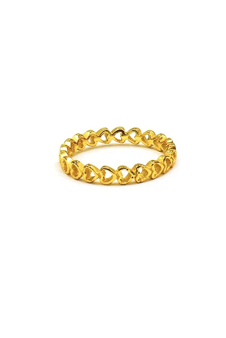 Gold-colored ring featuring a design of mini hearts, crafted from silver, showcasing elegance and charm.