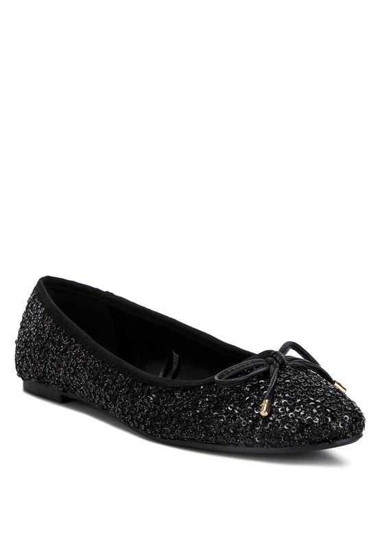Ringo Sequin Embellished Ballet Flats featuring a shimmering sequin exterior, faux leather upper, and elegant bow embellishment.