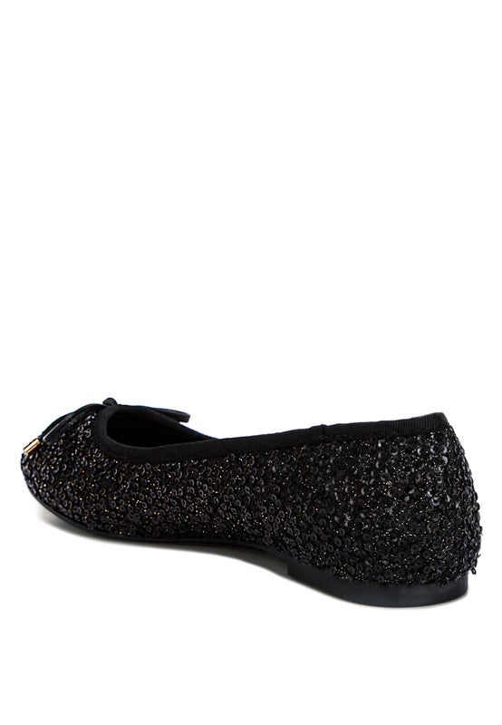 Ringo Sequin Embellished Ballet Flats featuring a shimmering sequin exterior, faux leather upper, and elegant bow embellishment.
