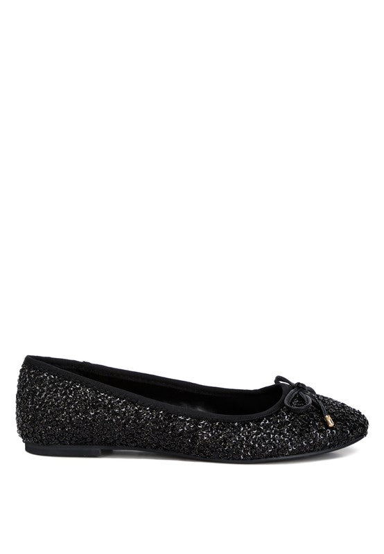 Ringo Sequin Embellished Ballet Flats featuring a shimmering sequin exterior, faux leather upper, and elegant bow embellishment.