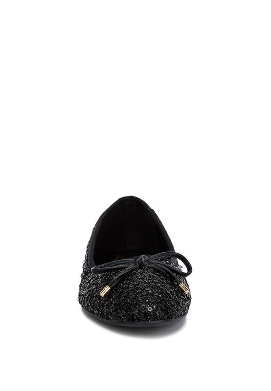 Ringo Sequin Embellished Ballet Flats featuring a shimmering sequin exterior, faux leather upper, and elegant bow embellishment.
