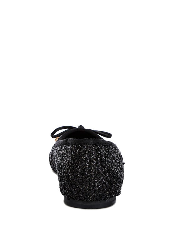 Ringo Sequin Embellished Ballet Flats featuring a shimmering sequin exterior, faux leather upper, and elegant bow embellishment.