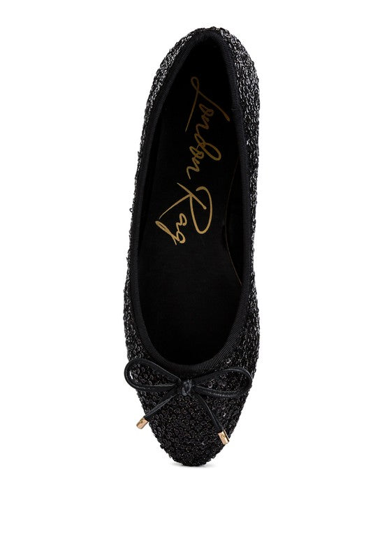 Ringo Sequin Embellished Ballet Flats featuring a shimmering sequin exterior, faux leather upper, and elegant bow embellishment.