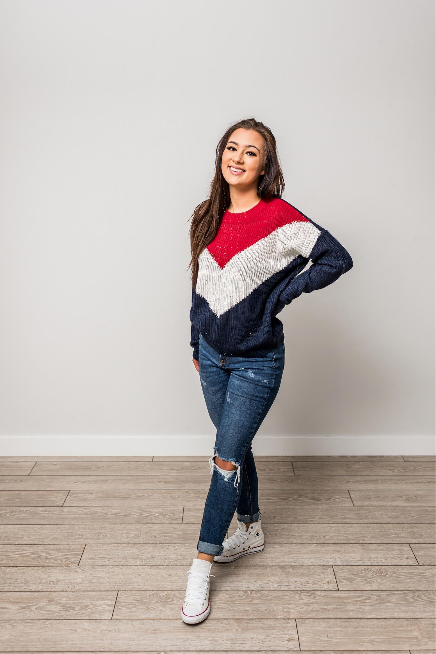 A stylish Round Neck Long Sleeve Chevron Colorblock Sweater featuring a trendy chevron pattern in vibrant colors, perfect for winter wear.