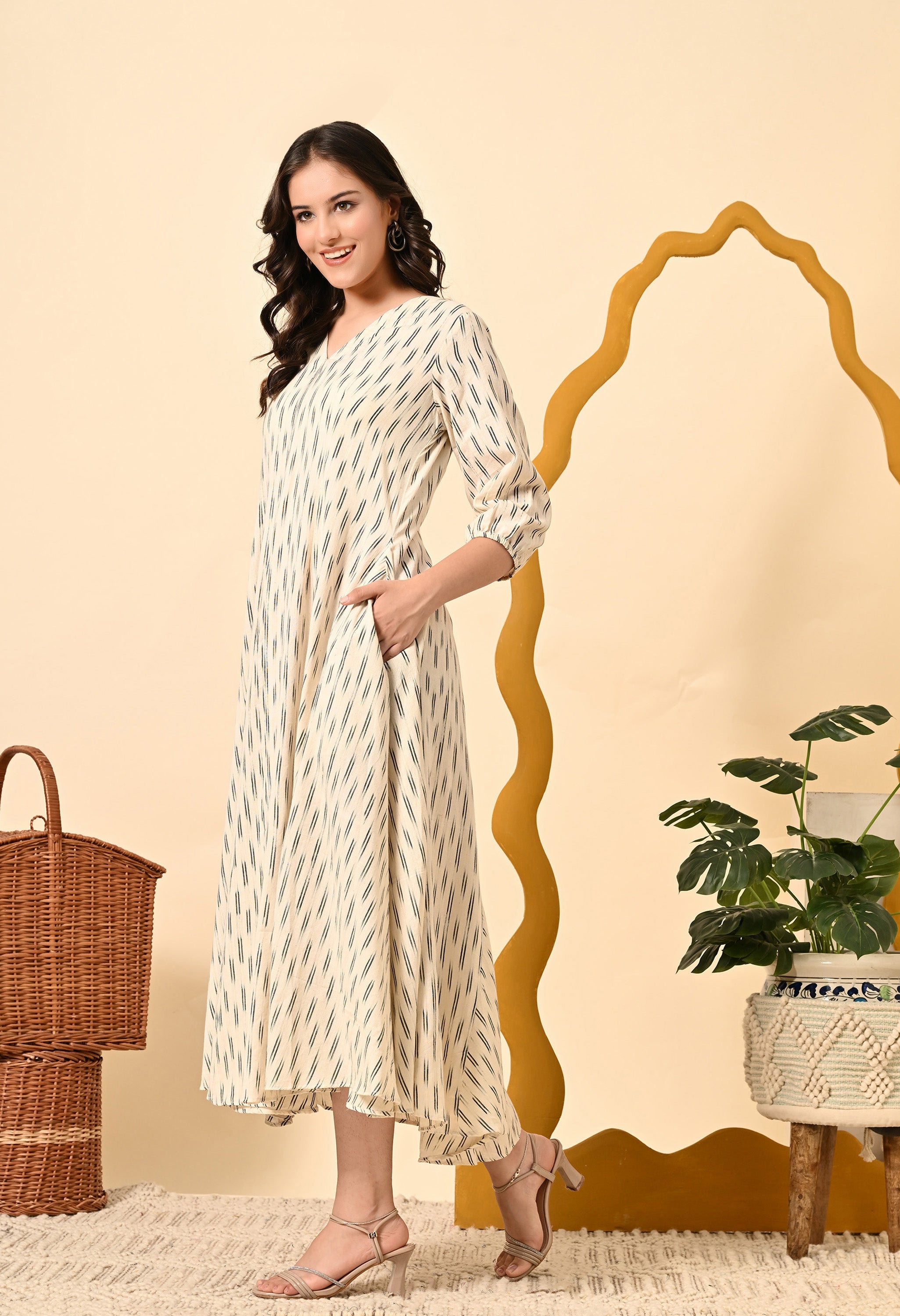 ROYALE VIII loose fit dress in off-white with puff sleeves and side pockets, featuring a flared style and asymmetrical hem.