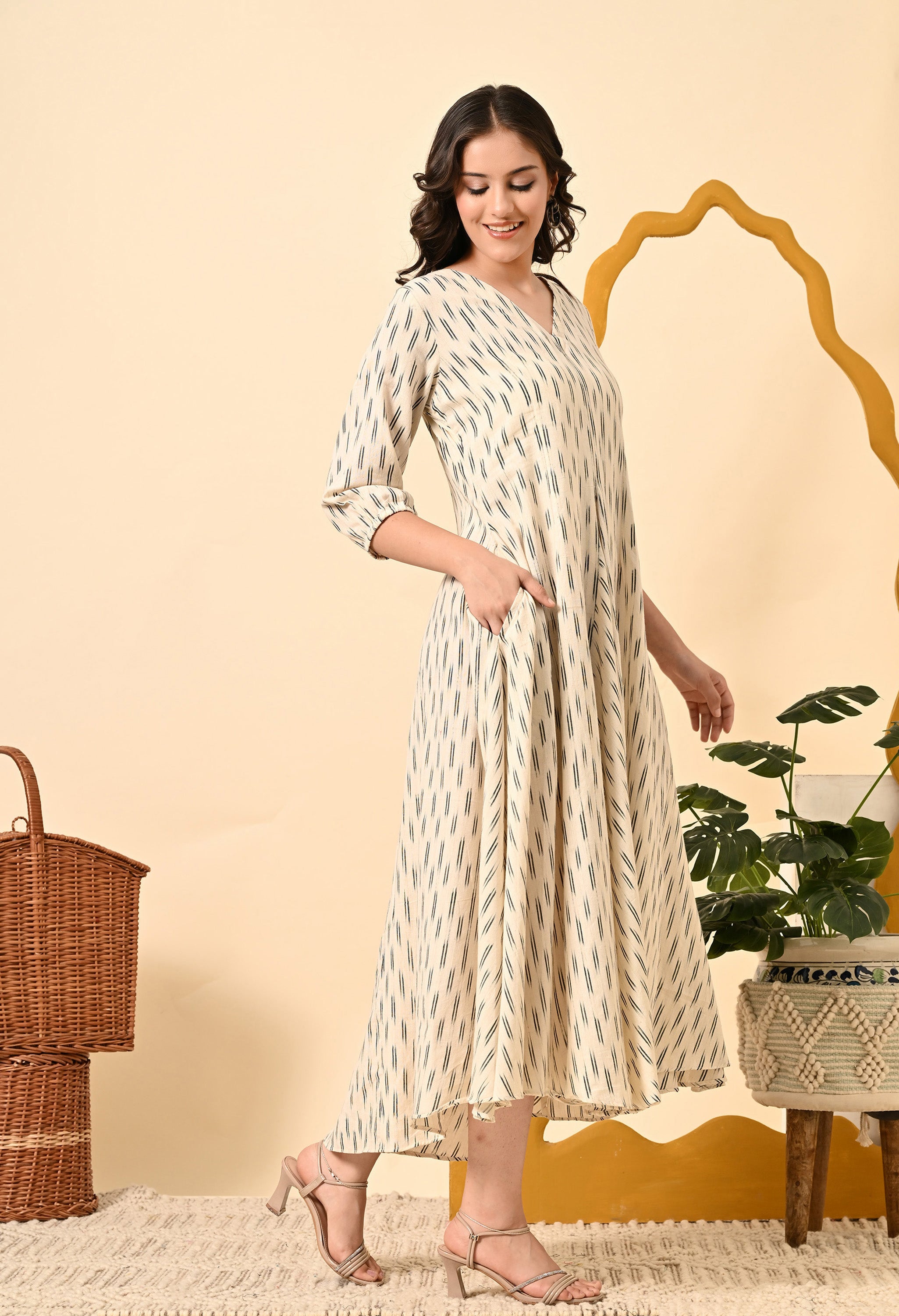 ROYALE VIII loose fit dress in off-white with puff sleeves and side pockets, featuring a flared style and asymmetrical hem.