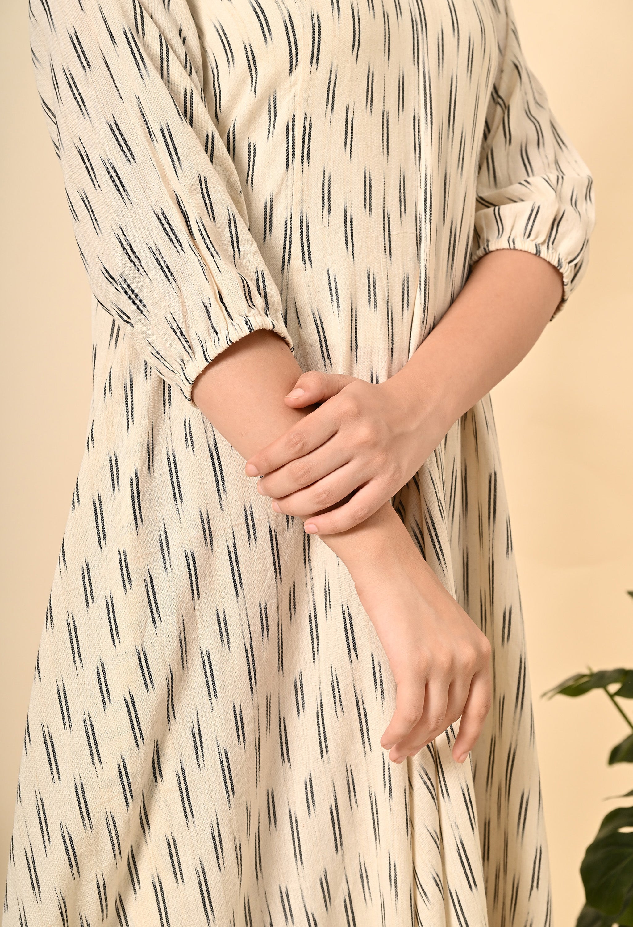 ROYALE VIII loose fit dress in off-white with puff sleeves and side pockets, featuring a flared style and asymmetrical hem.