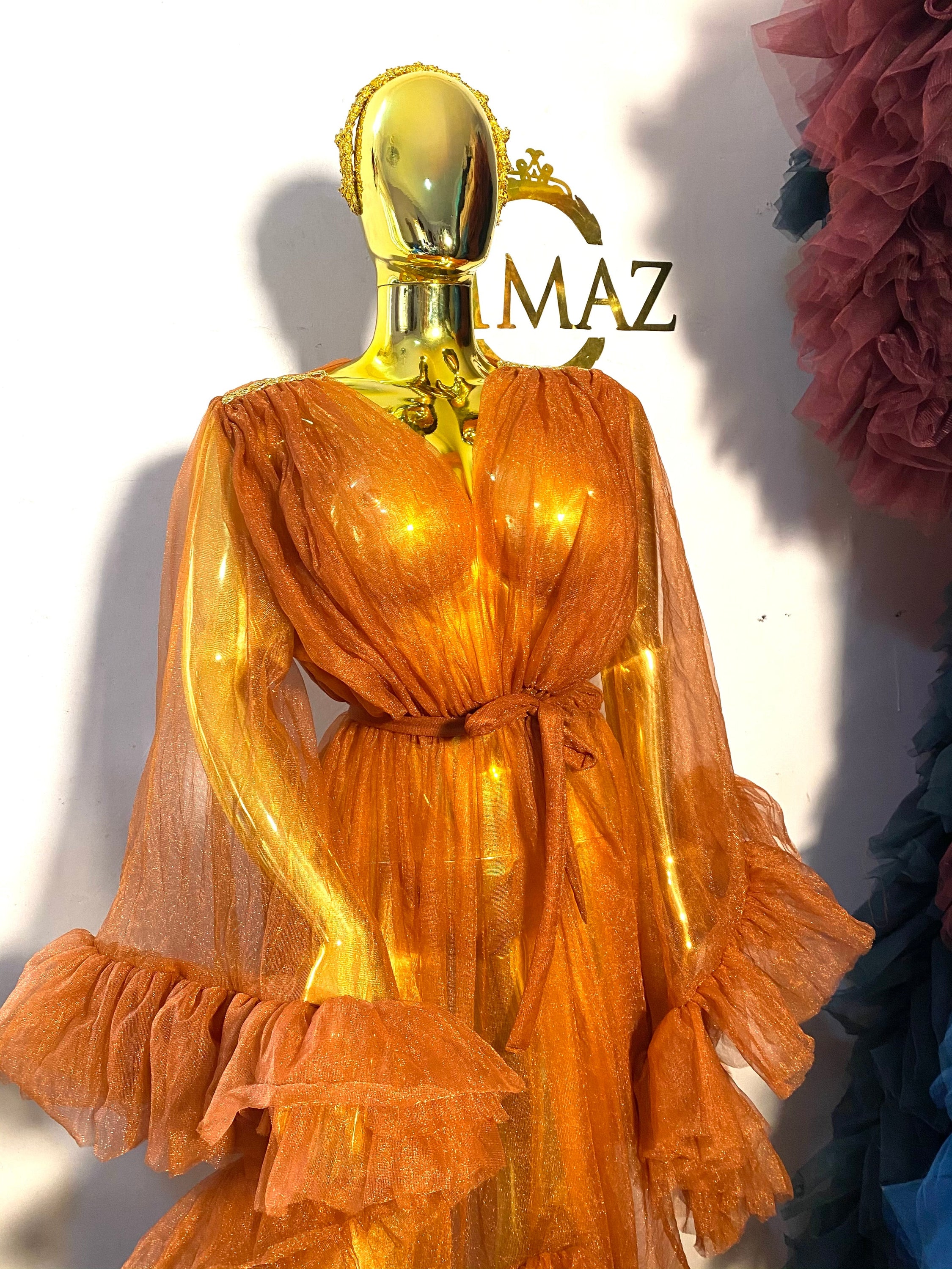 RTS AURORA dress featuring ruffled sleeves, open slit, and chain appliqué details in black color.