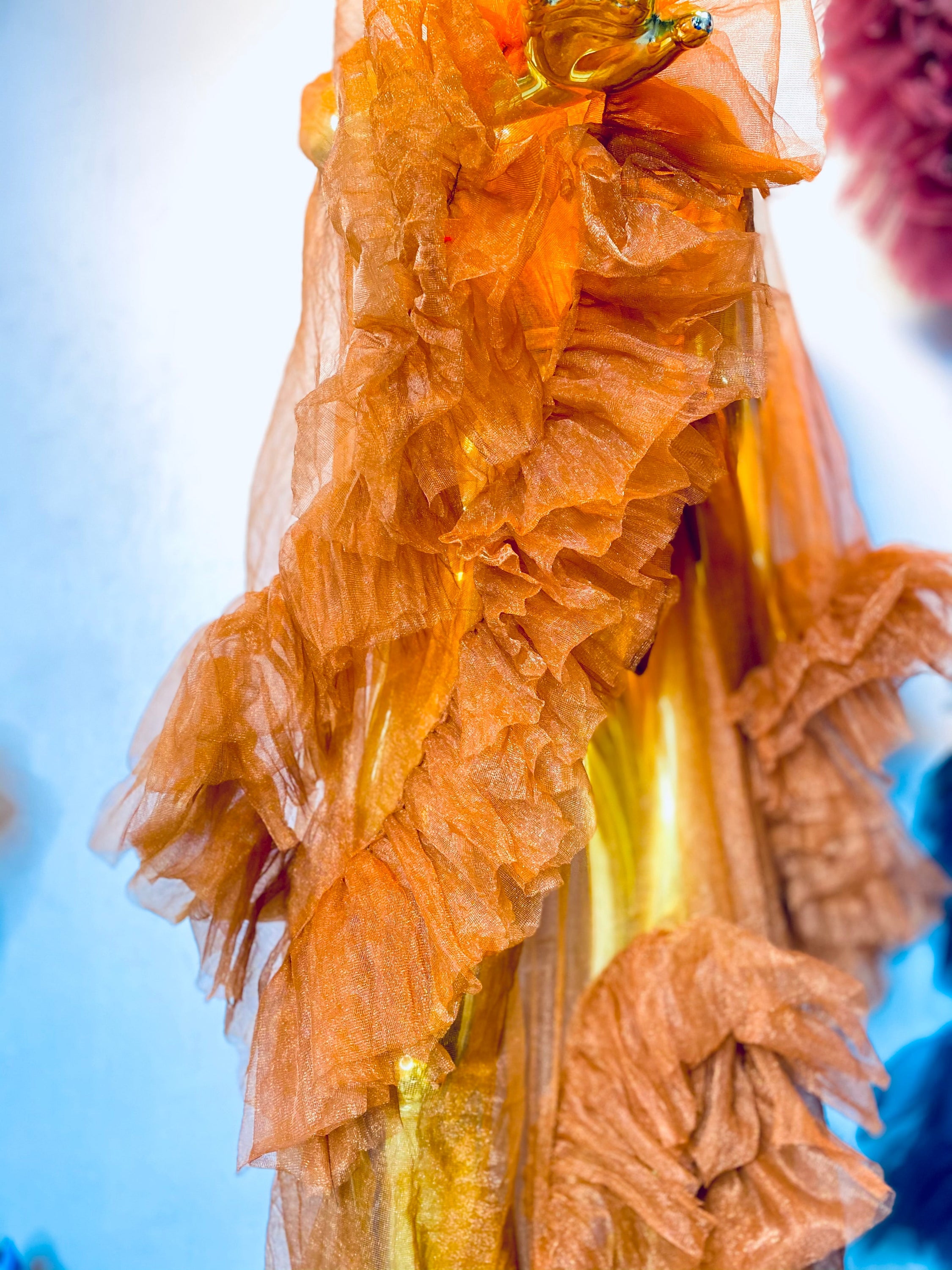 RTS AURORA dress featuring ruffled sleeves, open slit, and chain appliqué details in black color.