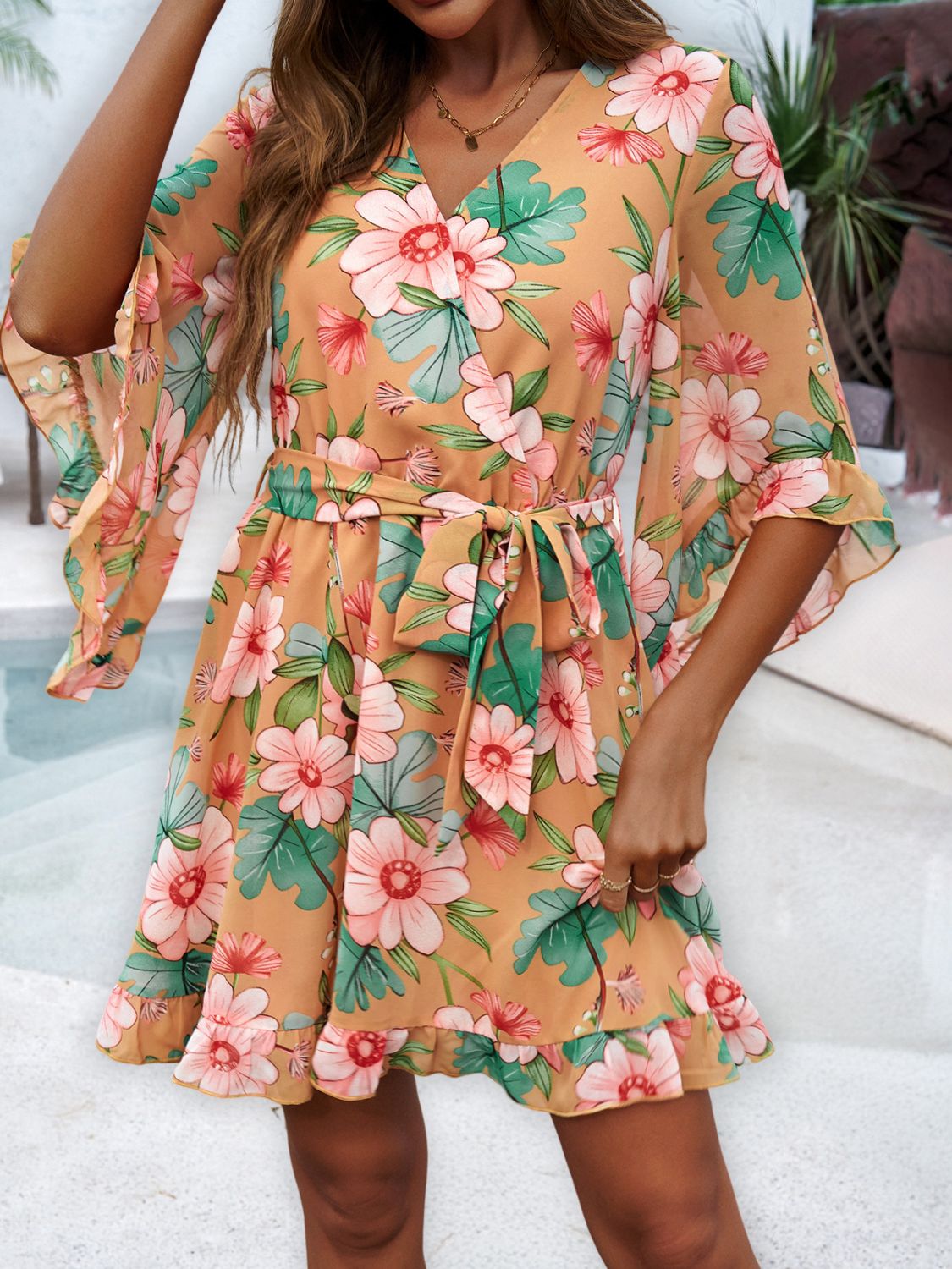 Ruffled Printed Surplice Half Sleeve Mini Dress showcasing elegant ruffles and a flattering silhouette, perfect for various occasions.