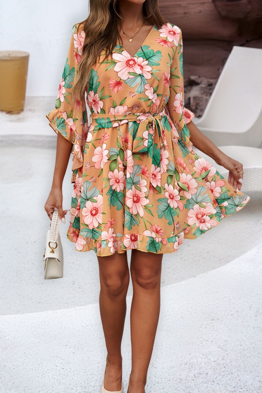 Ruffled Printed Surplice Half Sleeve Mini Dress showcasing elegant ruffles and a flattering silhouette, perfect for various occasions.