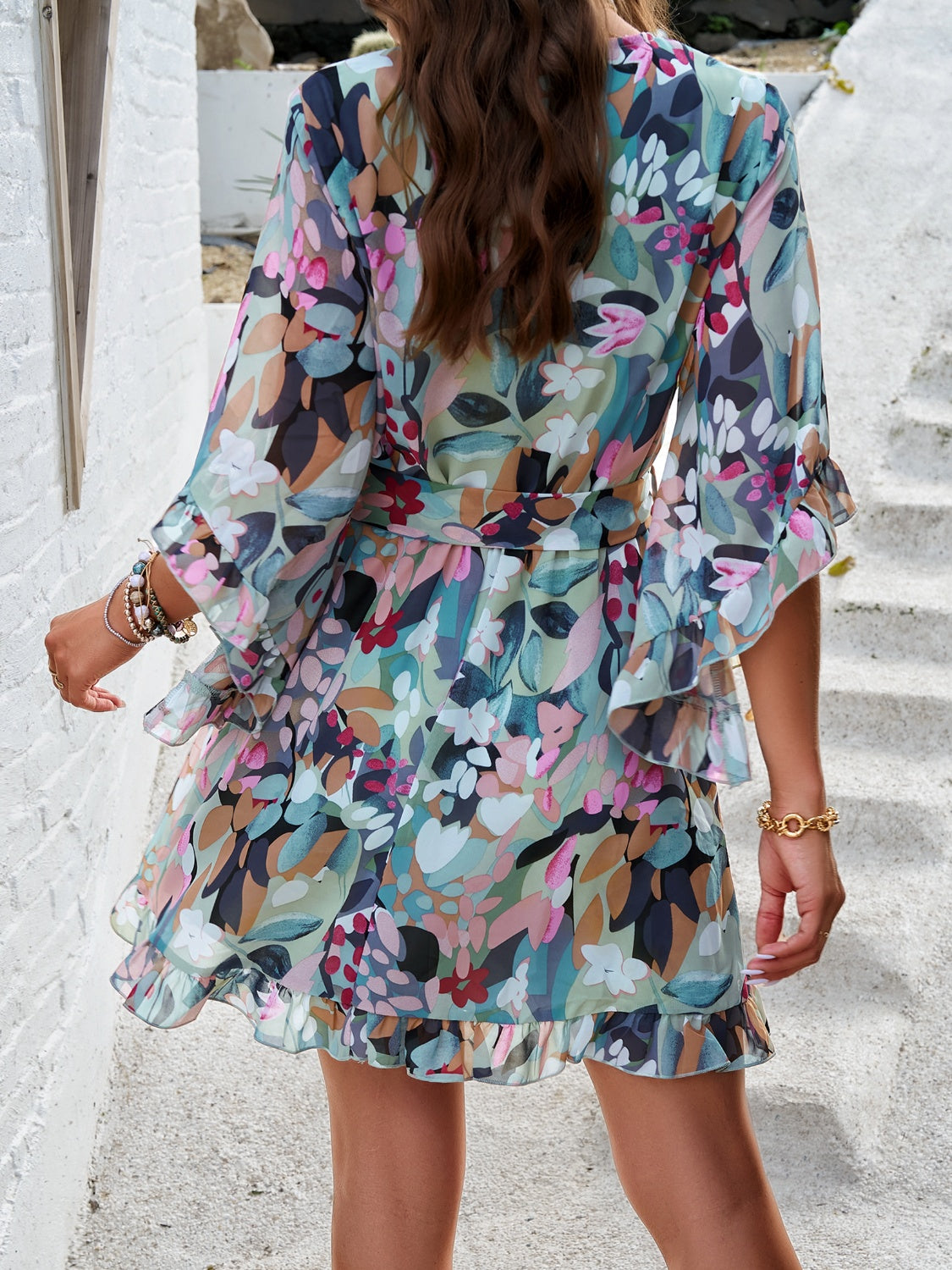 Ruffled Printed Surplice Half Sleeve Mini Dress showcasing elegant ruffles and a flattering silhouette, perfect for various occasions.