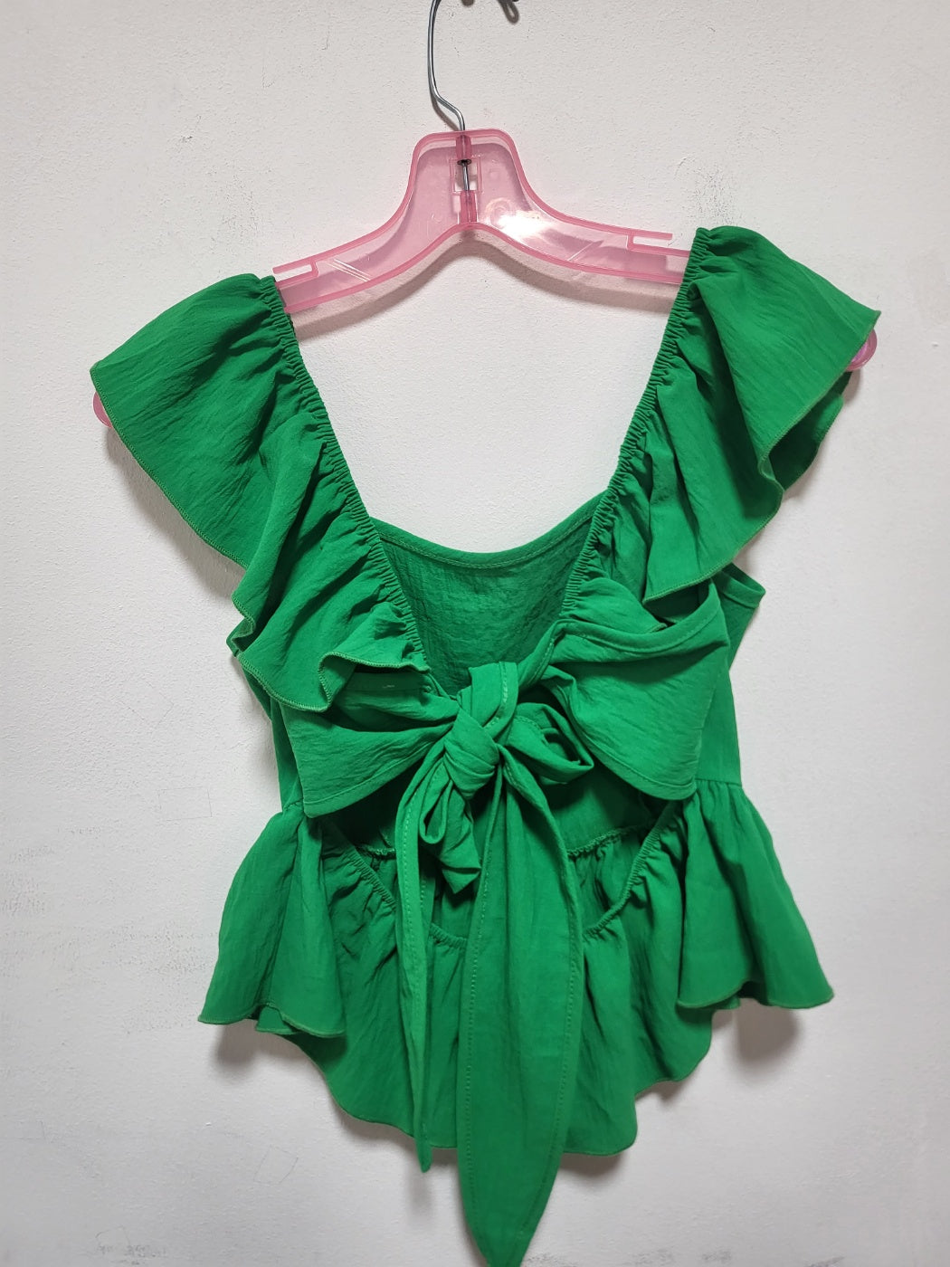 Ruffled Sleeve Square Neck Peplum Top featuring flutter sleeves and a peplum hem, styled elegantly on a mannequin.