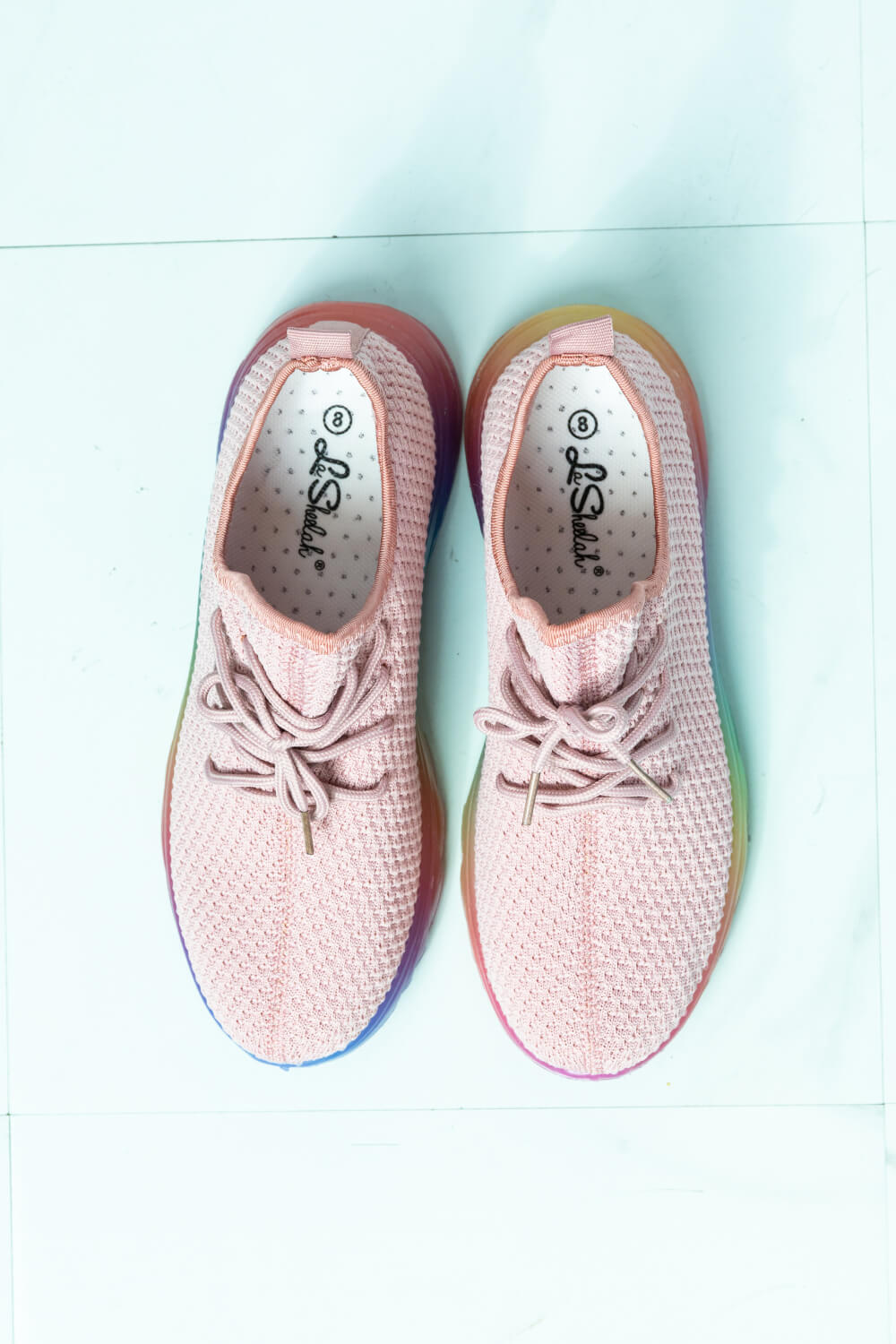 Runner's Delight Color Block Lace-Up Sneaker in Mauve featuring a vibrant rainbow gradient sole and breathable fabric upper.