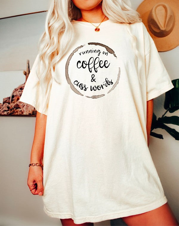 A stylish unisex crew neck tee featuring the phrase 'Running on Coffee and Cuss Words' printed on it, made from soft cotton fabric.