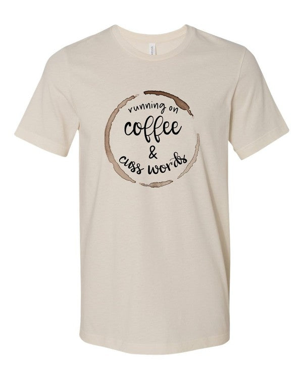 A stylish unisex crew neck tee featuring the phrase 'Running on Coffee and Cuss Words' printed on it, made from soft cotton fabric.