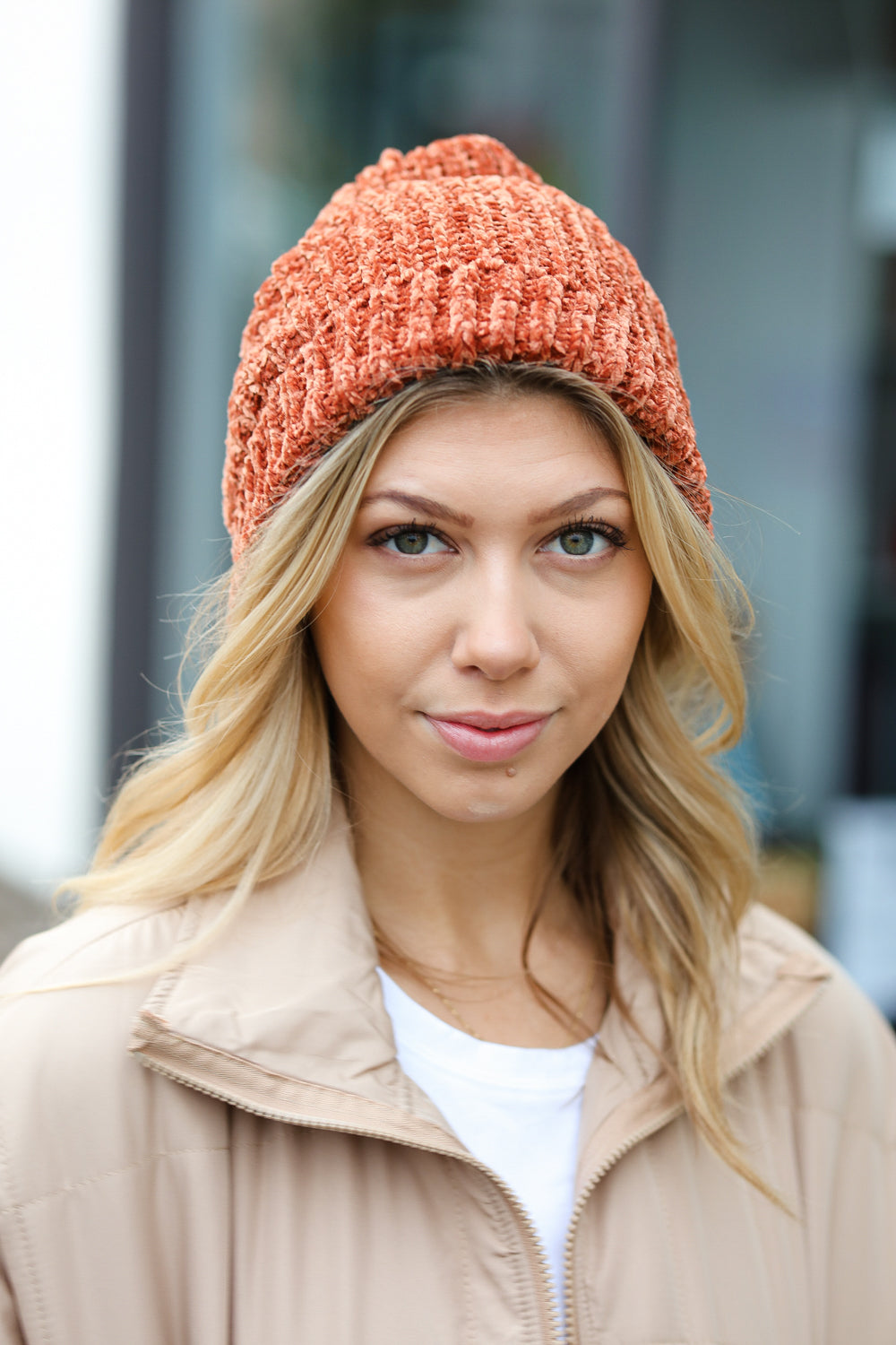 Rust Knit Velvet Chenille Fold Over Beanie showcasing its soft texture and stylish design, perfect for winter wear.