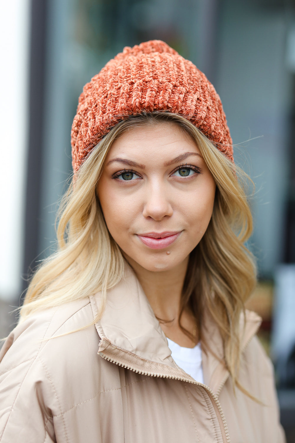 Rust Knit Velvet Chenille Fold Over Beanie showcasing its soft texture and stylish design, perfect for winter wear.