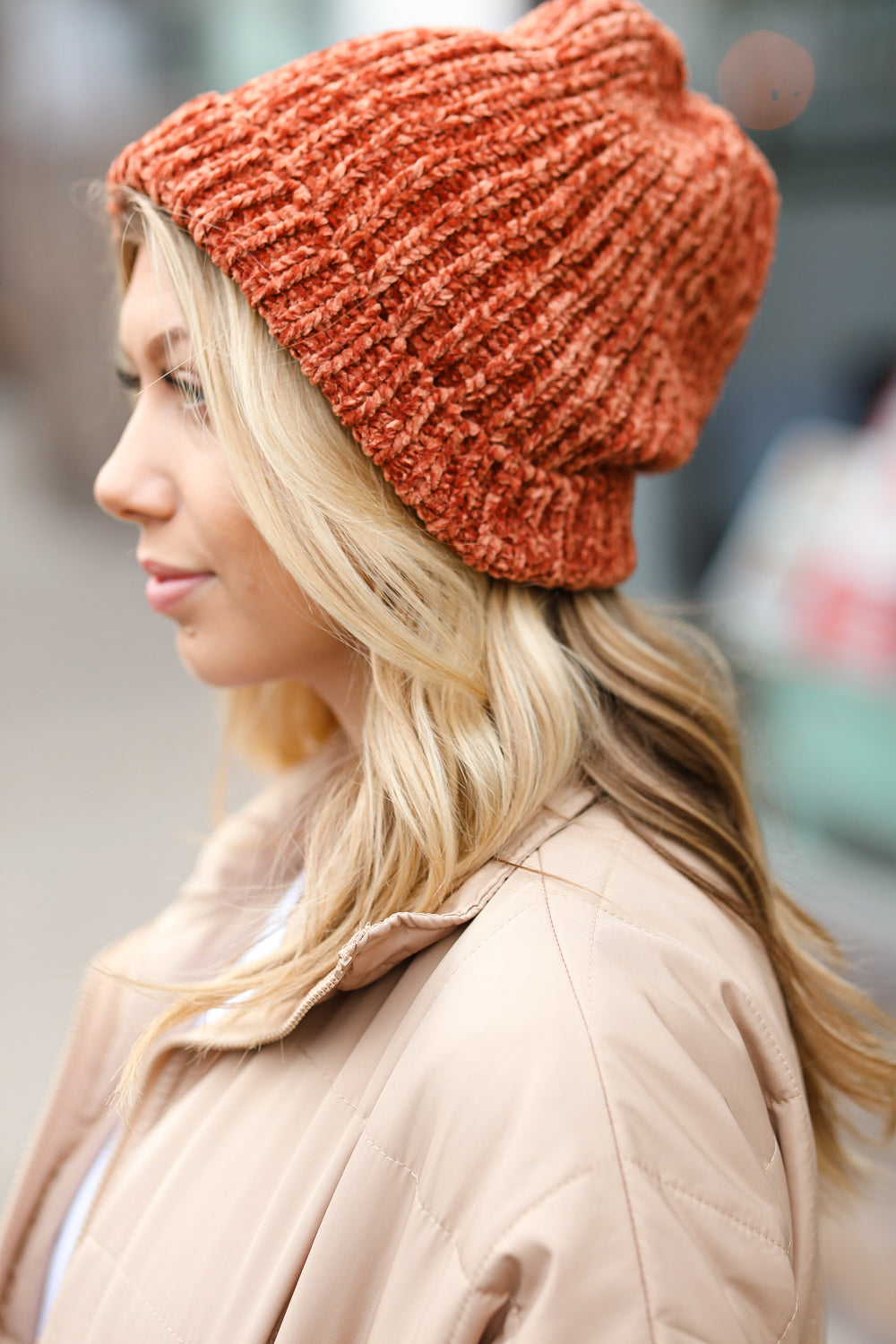 Rust Knit Velvet Chenille Fold Over Beanie showcasing its soft texture and stylish design, perfect for winter wear.