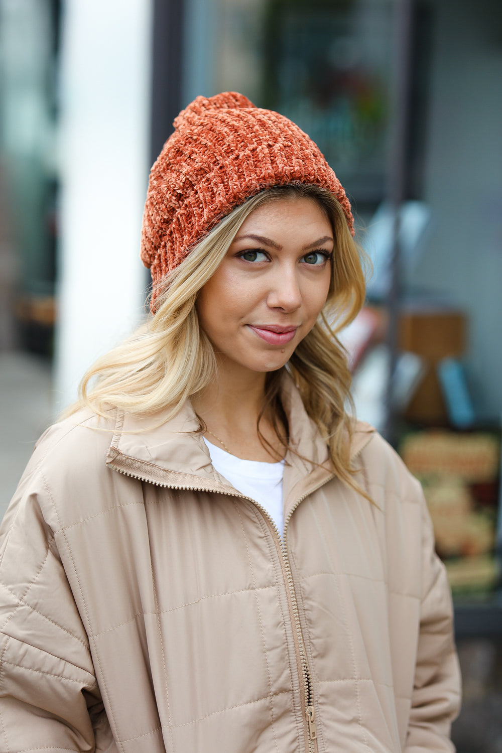 Rust Knit Velvet Chenille Fold Over Beanie showcasing its soft texture and stylish design, perfect for winter wear.