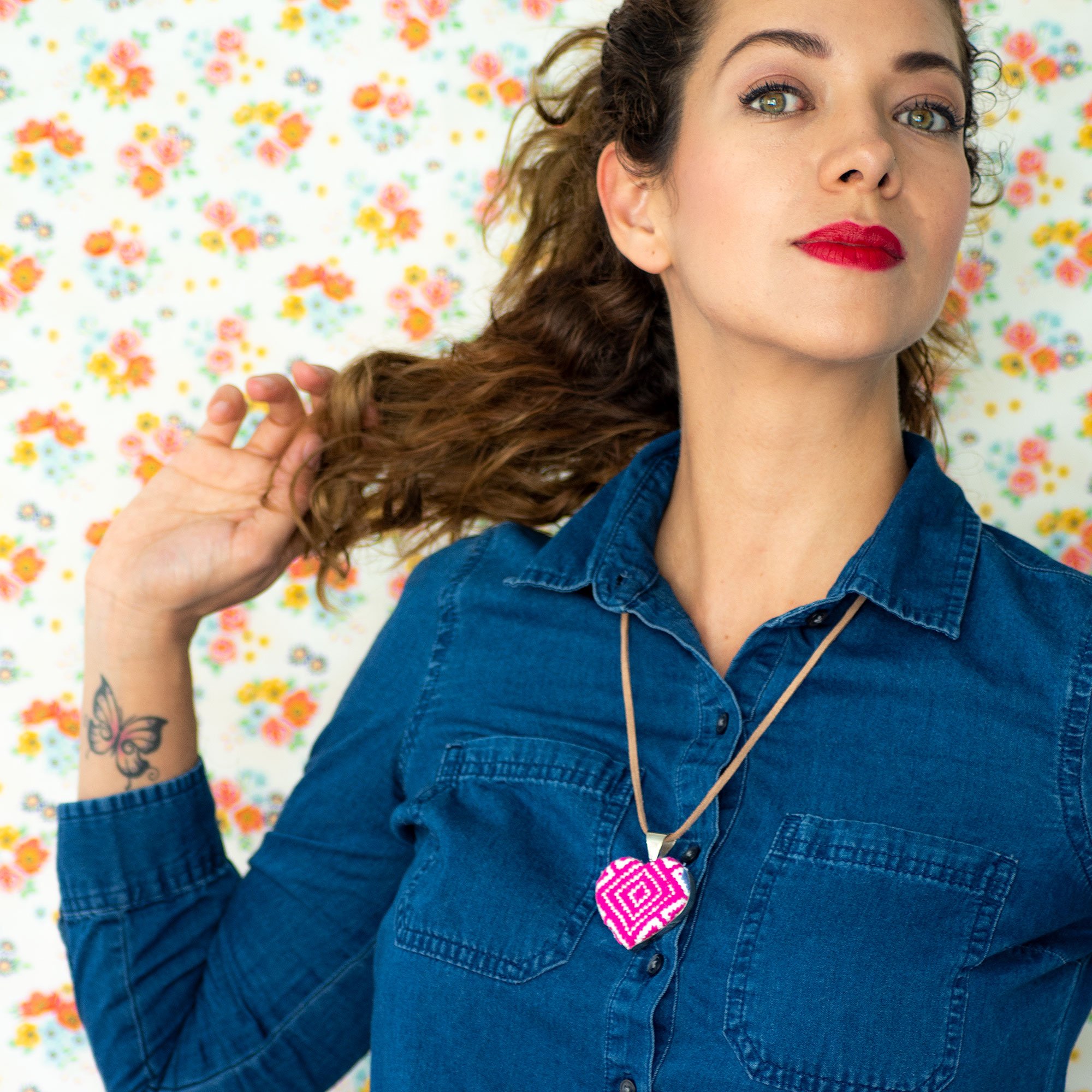 San Andres Heart Textile Necklace featuring a colorful embroidered heart pendant on a leather string, showcasing traditional craftsmanship from Chiapas, Mexico.