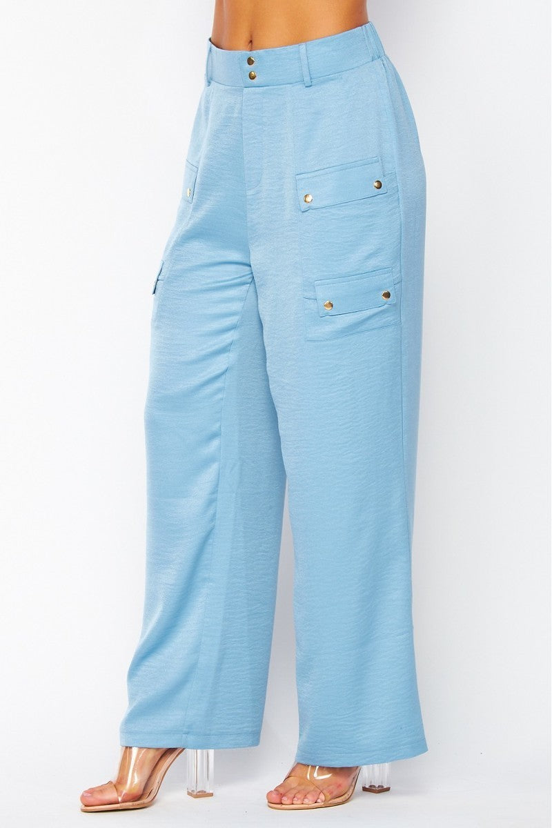 A pair of blue satin cargo pocket wide leg pants featuring four side pockets, showcasing a stylish and comfortable design.