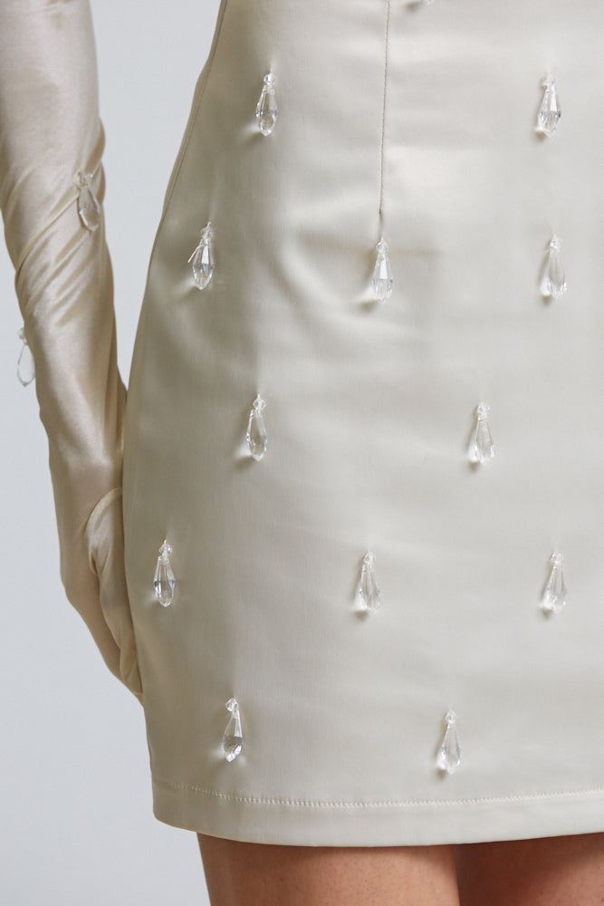 Elegant Satin Serenity Strapless Dress featuring luxe satin fabric, adjustable shoulder strap, and tear drop bead detailing.