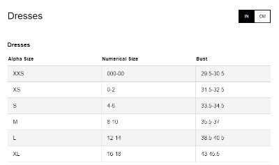 Scoop Neck Ruched Mini Dress featuring long sleeves and a flared mini skirt with trendy tiers.