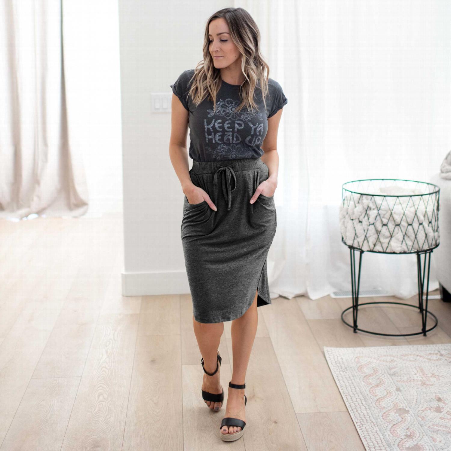 Self Tie Tulip Hem Skirt with Side Pockets in golden mustard color, showcasing its high-waist design and stylish tulip hem.