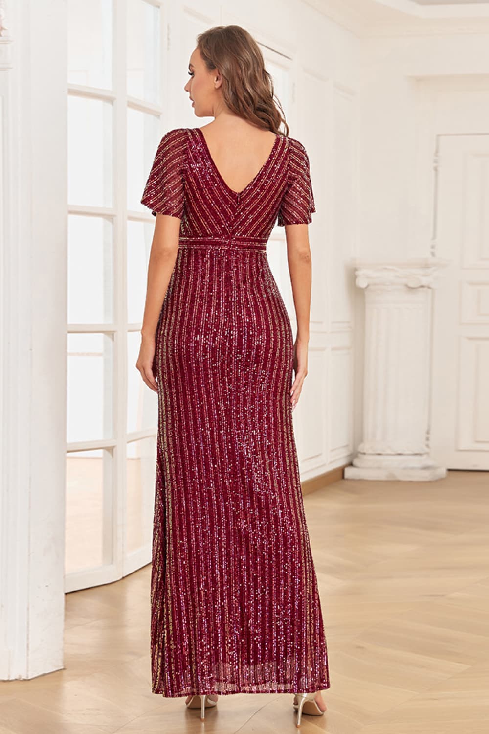 A stylish Sequin Flutter Sleeve Formal Dress featuring a striped pattern, flutter sleeves, and a surplice neckline, perfect for formal occasions.