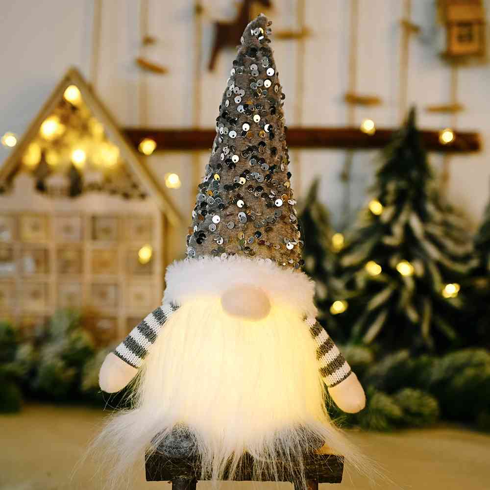A charming Sequin Light-Up Faceless Gnome, featuring a sparkling design and vibrant colors, perfect for festive home decor.